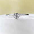 Minimalist sterling silver ring with crown shape and engraved line detail in gold or platinum finish