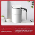 White automatic electric stirring cup with LCD screen and USB charging cable.