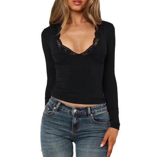 Black slim-fit women's long sleeve top with floral lace detailing on the front.