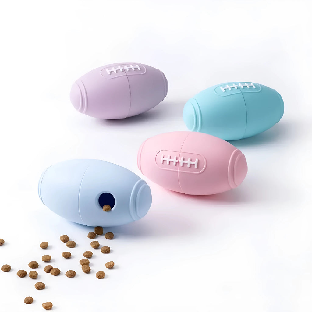 Silicone rugby ball dog chew toy with treat dispenser in four colour variations