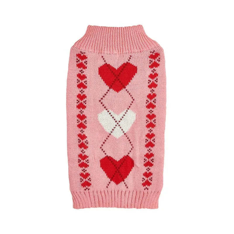 Red love heart design dog sweater on small dog showing acrylic knit and decorative motifs