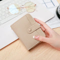 Lychee pattern pu leather ladies short wallet in two-fold design showing beige colour option.