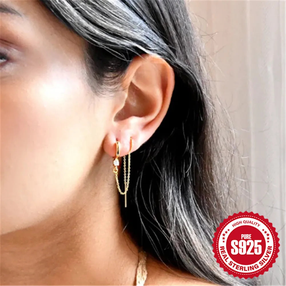 S925 sterling silver geometric ear clip studs with flower and chain design in golden electroplate.