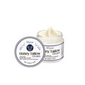 A 60g glass jar of Cow Fat Moisturising Cream with tallow, honey, and vitamins.