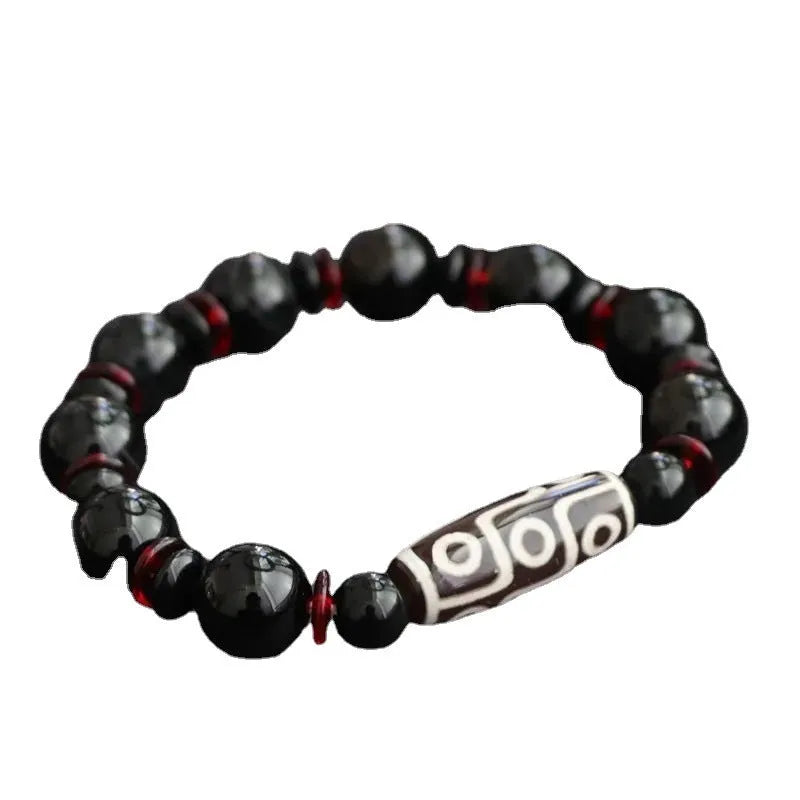 Black agate dzi bead bracelet with 11mm round beads in hand-woven geometry pattern