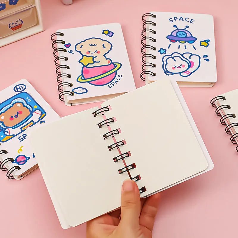 Astronaut-themed flip notebook in pocket size 10.5 by 8 cm with space cat cover design.