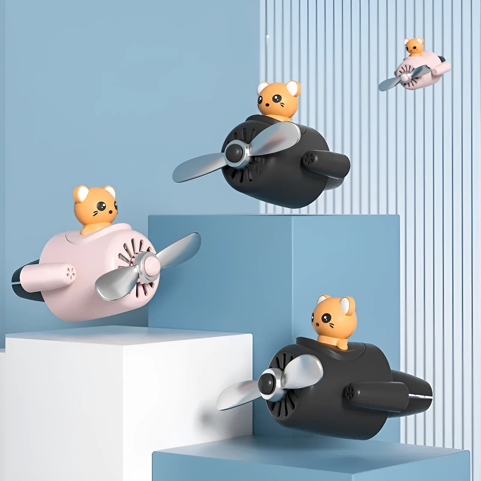 Cartoon small aeroplane shaped plastic car vent aromatherapy clip in black, blue, orange, or pink.