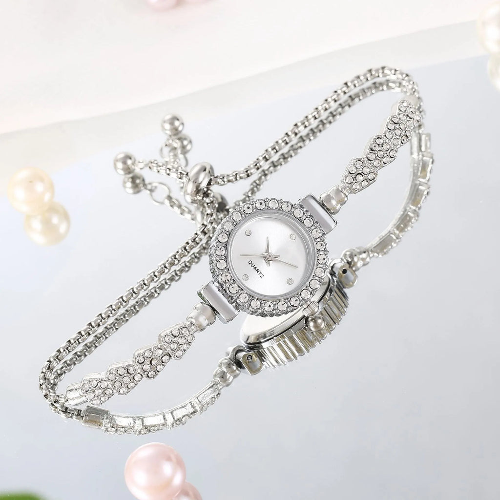 Gold fine strap women's watch with round dial and stainless steel jewellery buckle