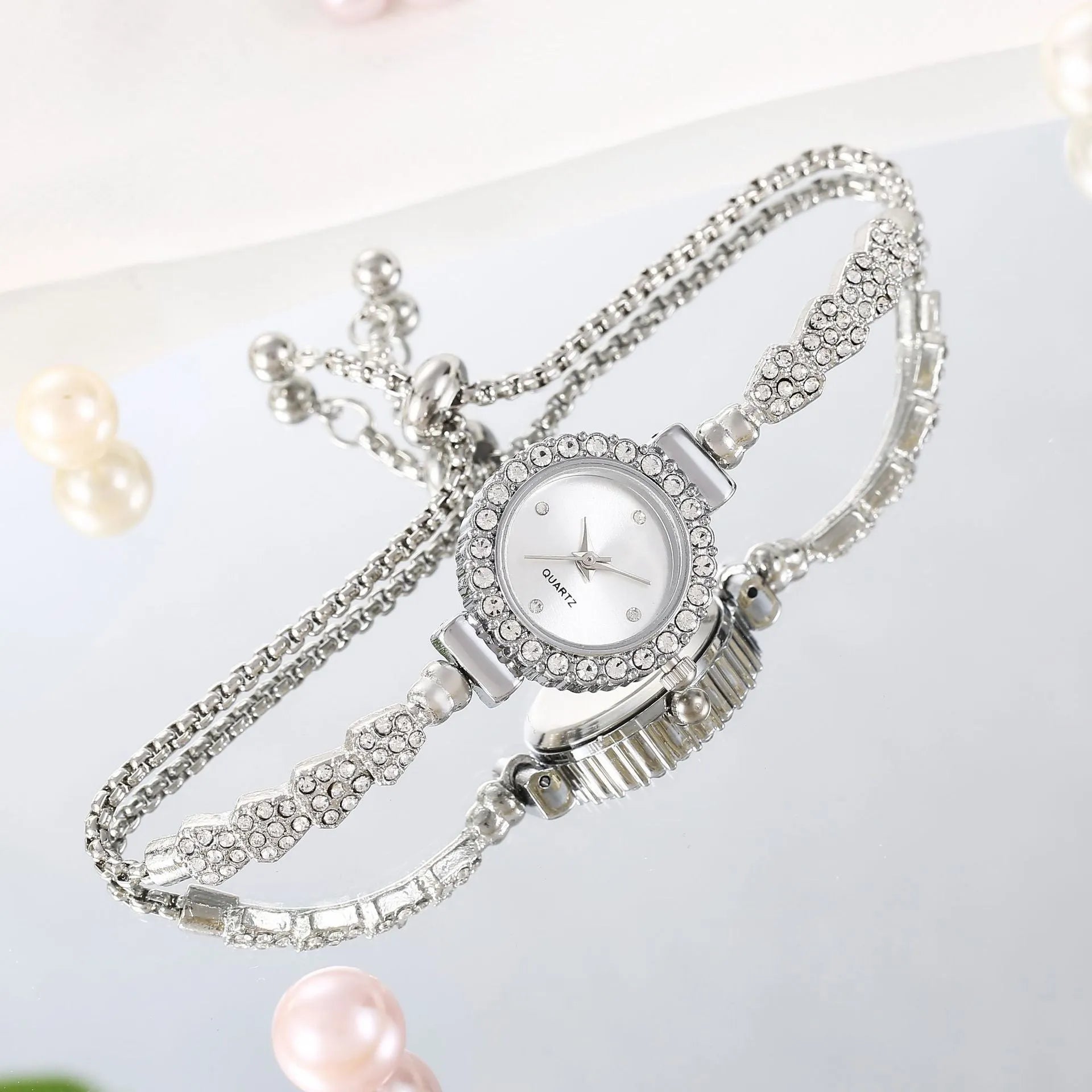 Gold fine strap women's watch with round dial and stainless steel jewellery buckle