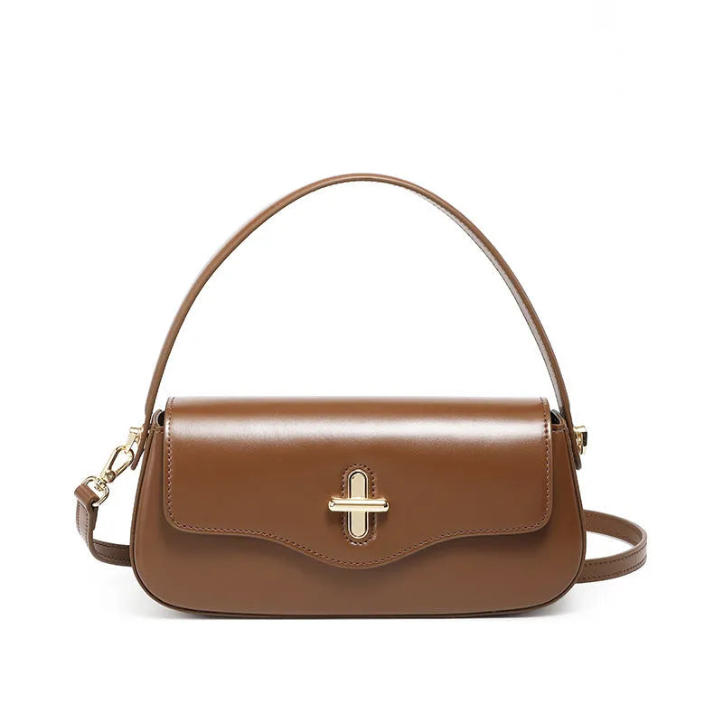 Genuine leather baguette handbag in caramel colour with clamshell design and shoulder straps