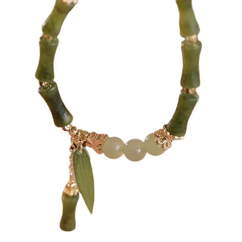 Chinese style glass bracelet with bamboo joint design elements in multiple colour options