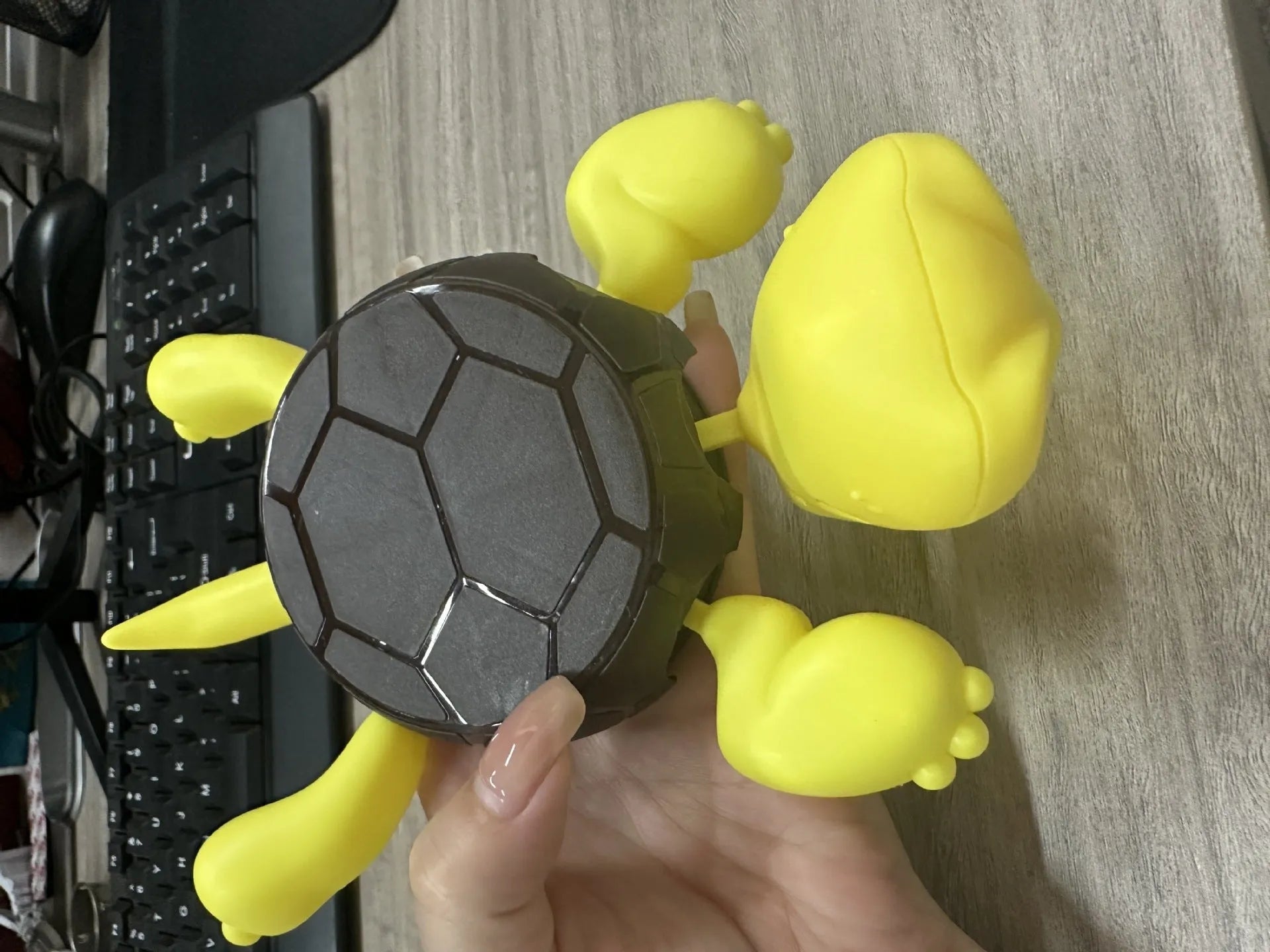 Turtle-shaped ABS plastic coaster in light green colour for heat insulation under drinks