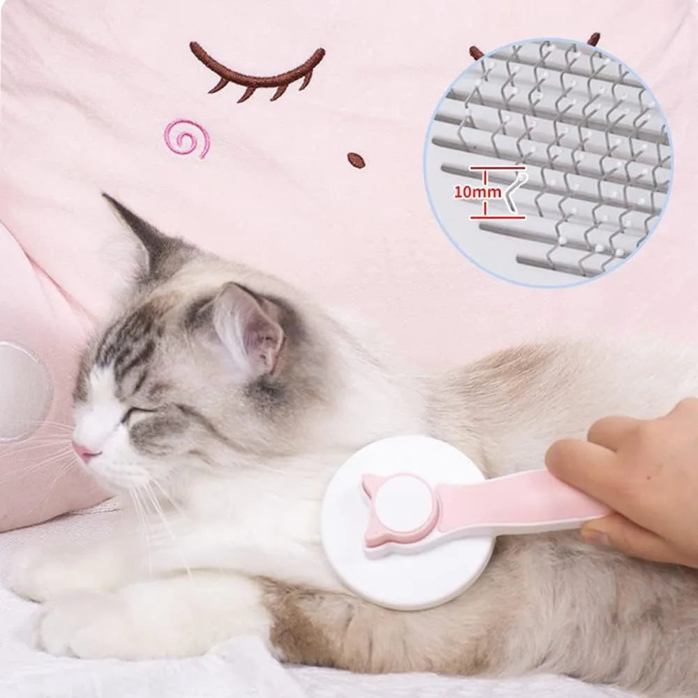 Self-cleaning cat brush with blue handle and rubber-tipped metal pins