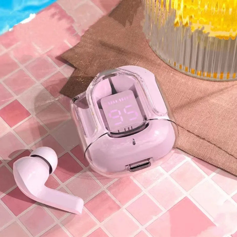 Transparent space capsule case containing white Bluetooth earbuds with a digital battery display.
