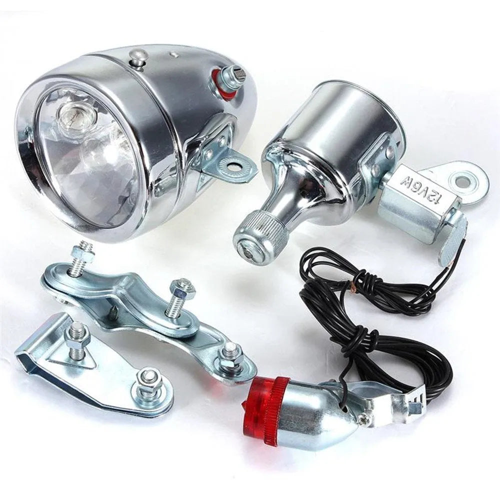 Silver bicycle dynamo-powered generator light kit for front fork or rear frame mounting.