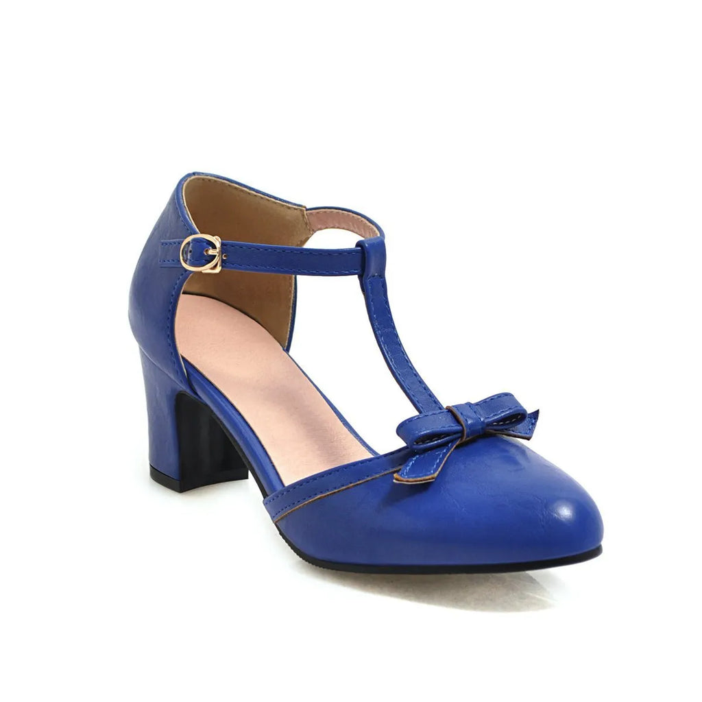 Women's apricot chunky heel sandals with a buckle strap and bow detail on a hollow-out PU upper.