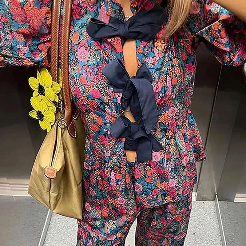Women's floral printed polyester trousers suit with puff sleeves and tie-neck detail