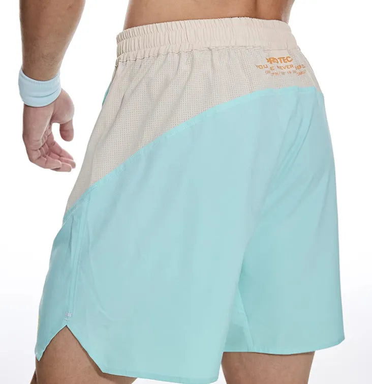 Men's loose grey Hipp workout lifting shorts with elastic lace-up fly on a plain background.