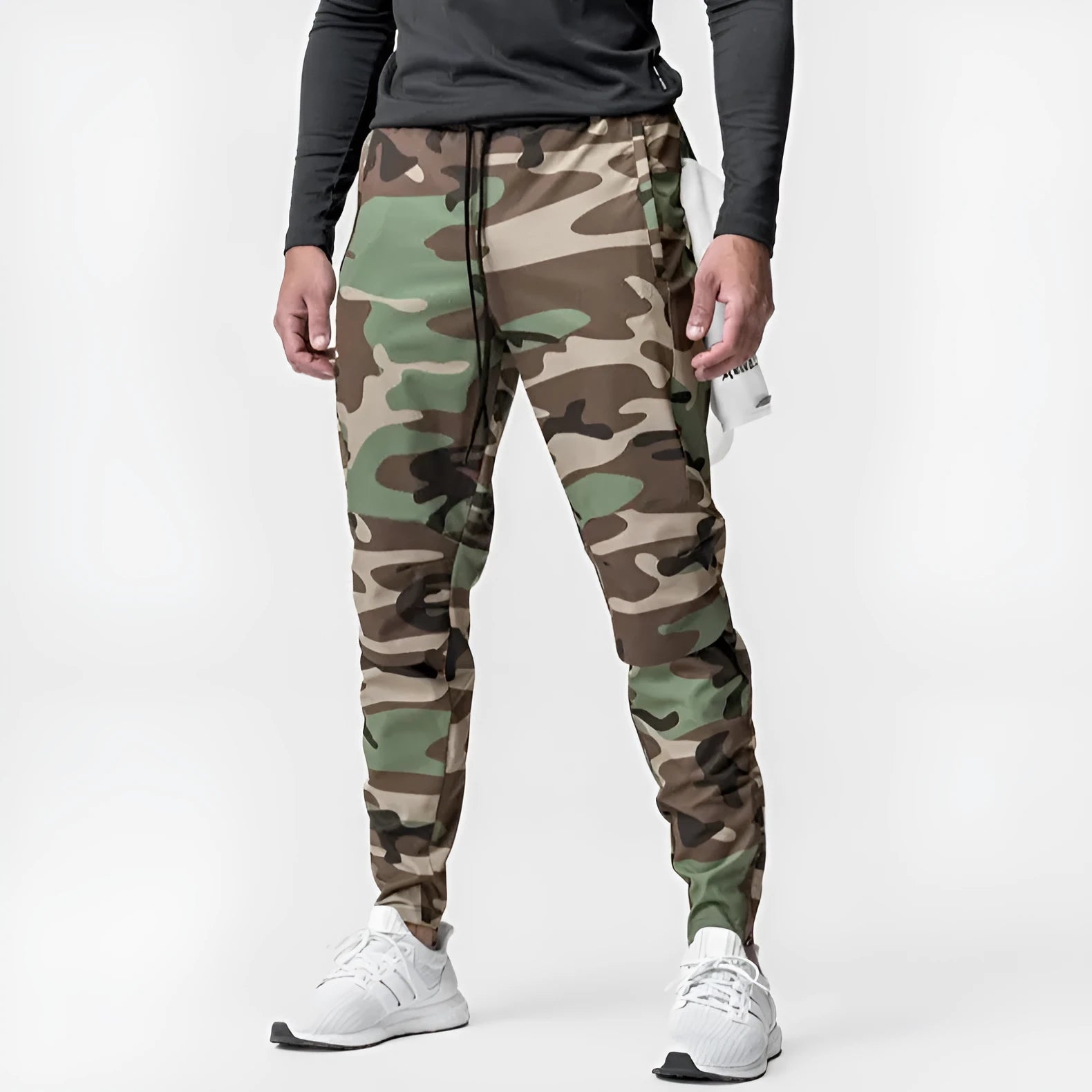Men's loose grey ankle-tied fitness pants with a casual cut for running and gym workouts.