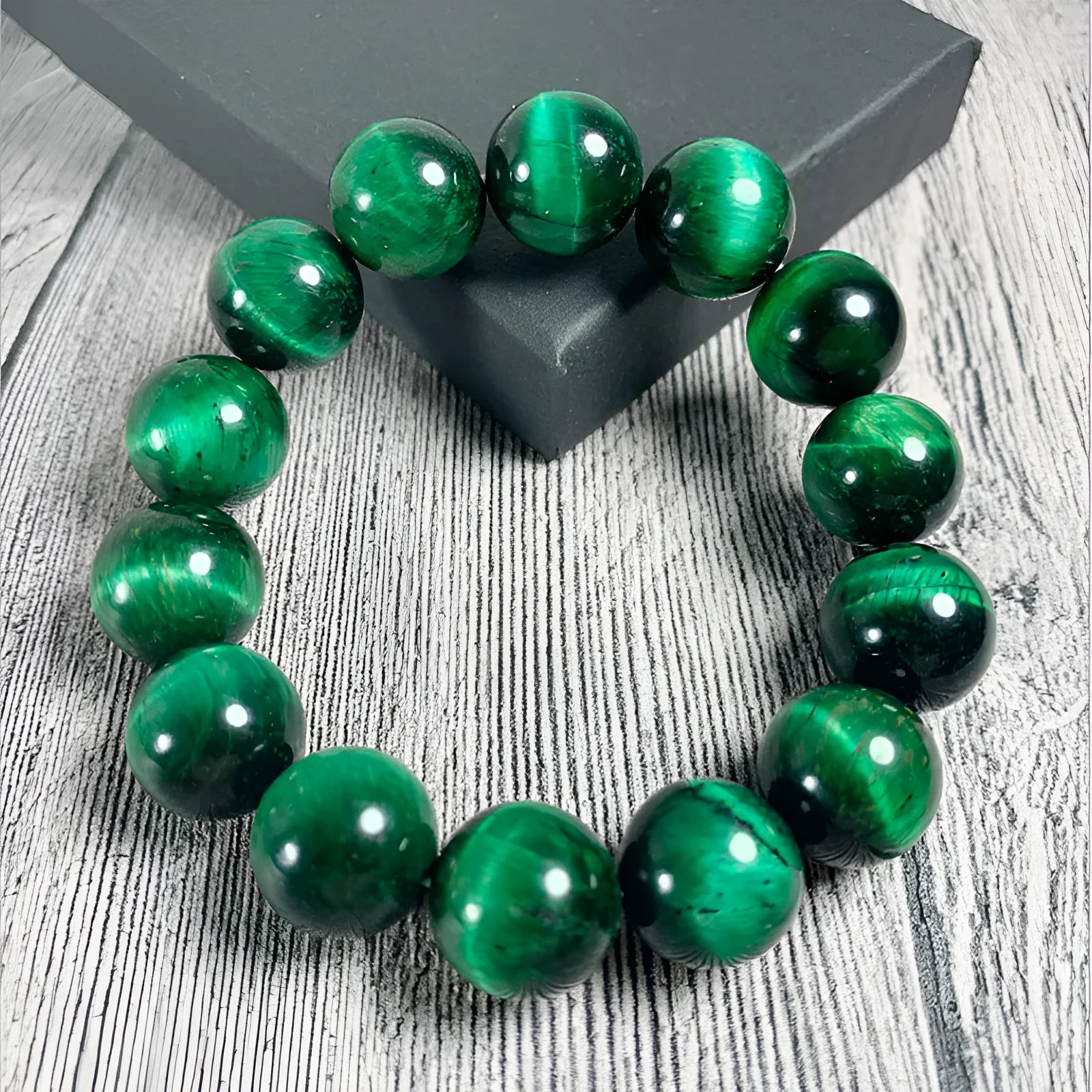 Green Tiger Eye stone bracelet with polished geometric beads on a wrist
