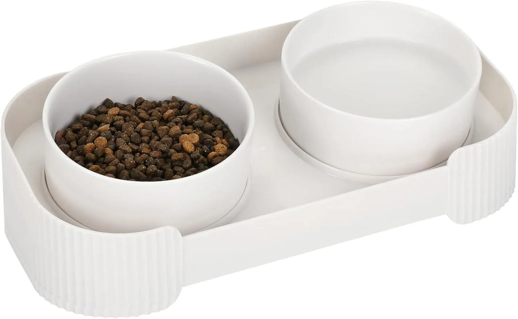 Green elevated ceramic cat bowl set with two bowls on a tilted stand, showing non-slip base.