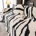 Zebra pattern flannel sofa cover with matching pillowcase in a light luxury style.