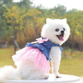 Korean-inspired pink denim pet skirt with a large bow on a dog model.