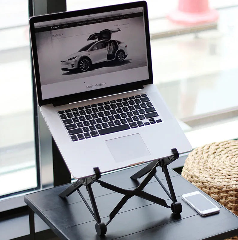Black foldable laptop stand with height adjustment and protective nylon carrying case