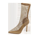 Gold women's high heel sandals with mesh upper, pointed toe, stiletto heel, and oversleeve design.