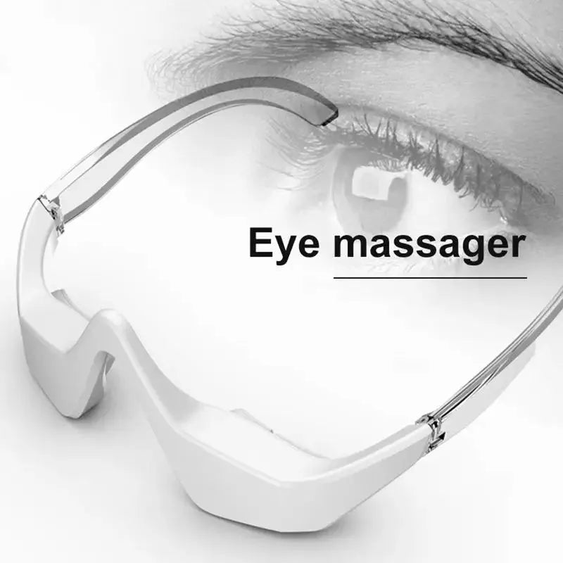 Pink and white 3D micro-current eye massager shaped like glasses on a grey background.