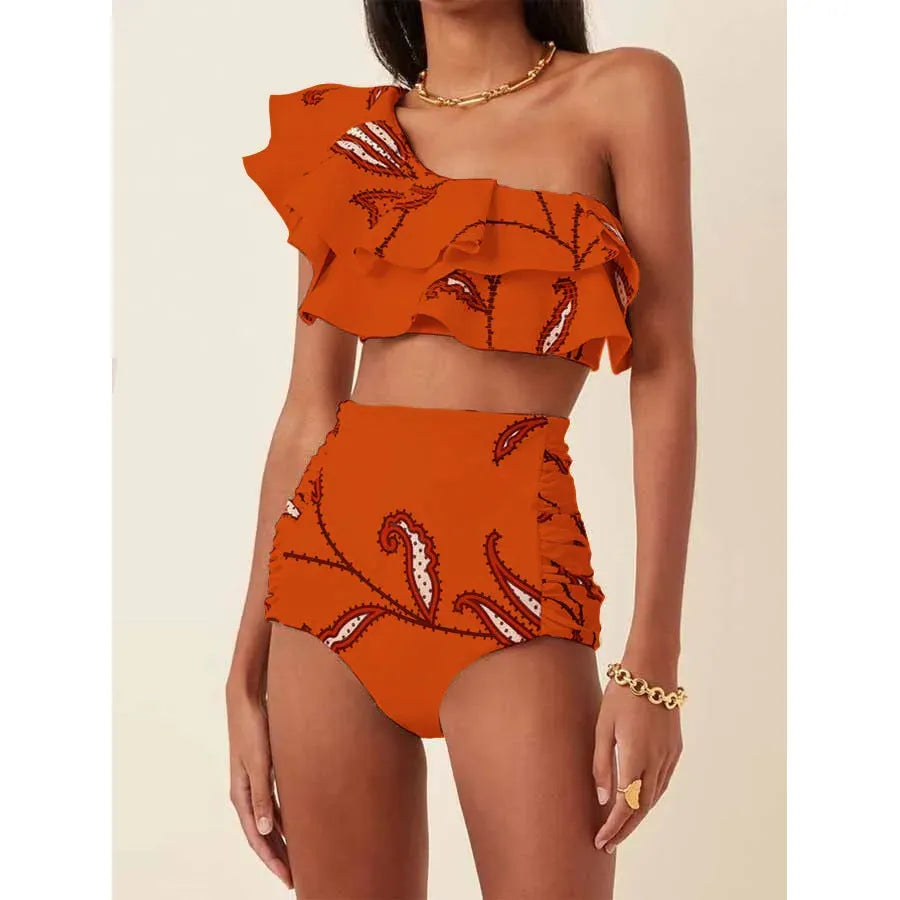 Women's beige bikini suit with ruffled oblique shoulder top and high-waist briefs on a mannequin.