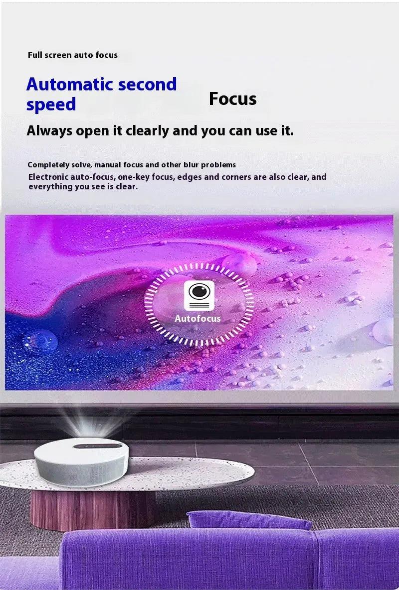 White HD projector unit with remote control on a table for home cinema use.