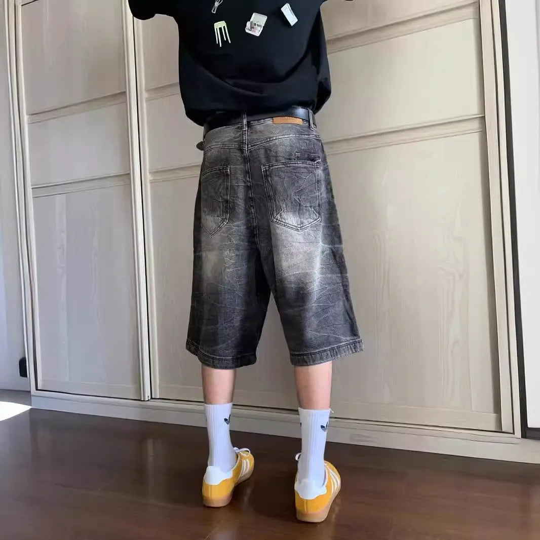 Men's loose washed denim shorts with straight-leg cropped design in retro style