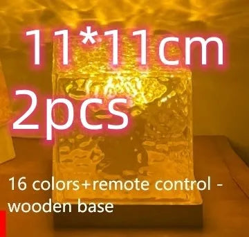 LED water ripple night light with rotating crystal projection and remote control on wooden surface