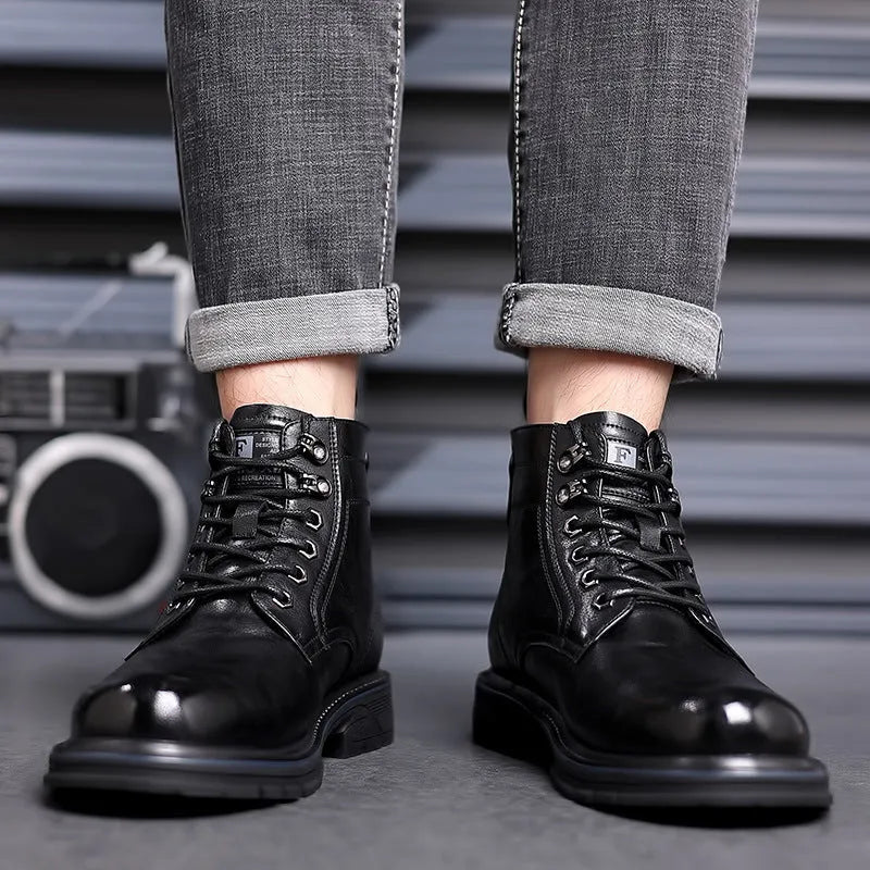 Black women's patent leather ankle boots with a low square heel and high cylinder shaft on a plain background.
