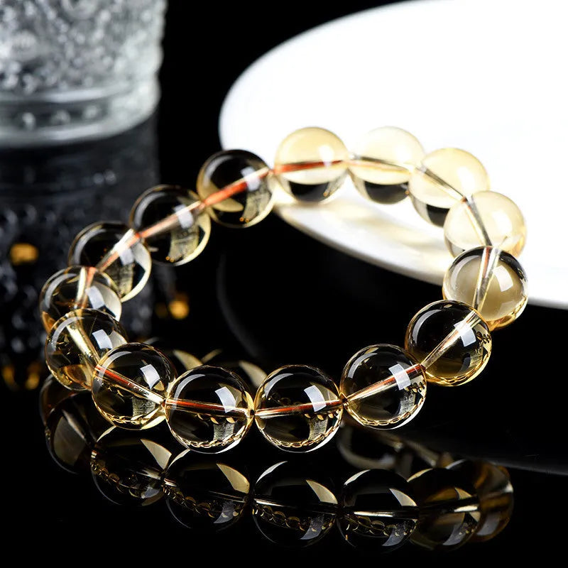 Natural citrine scattered beads ball bracelet showing polished beads on a bracelet base.
