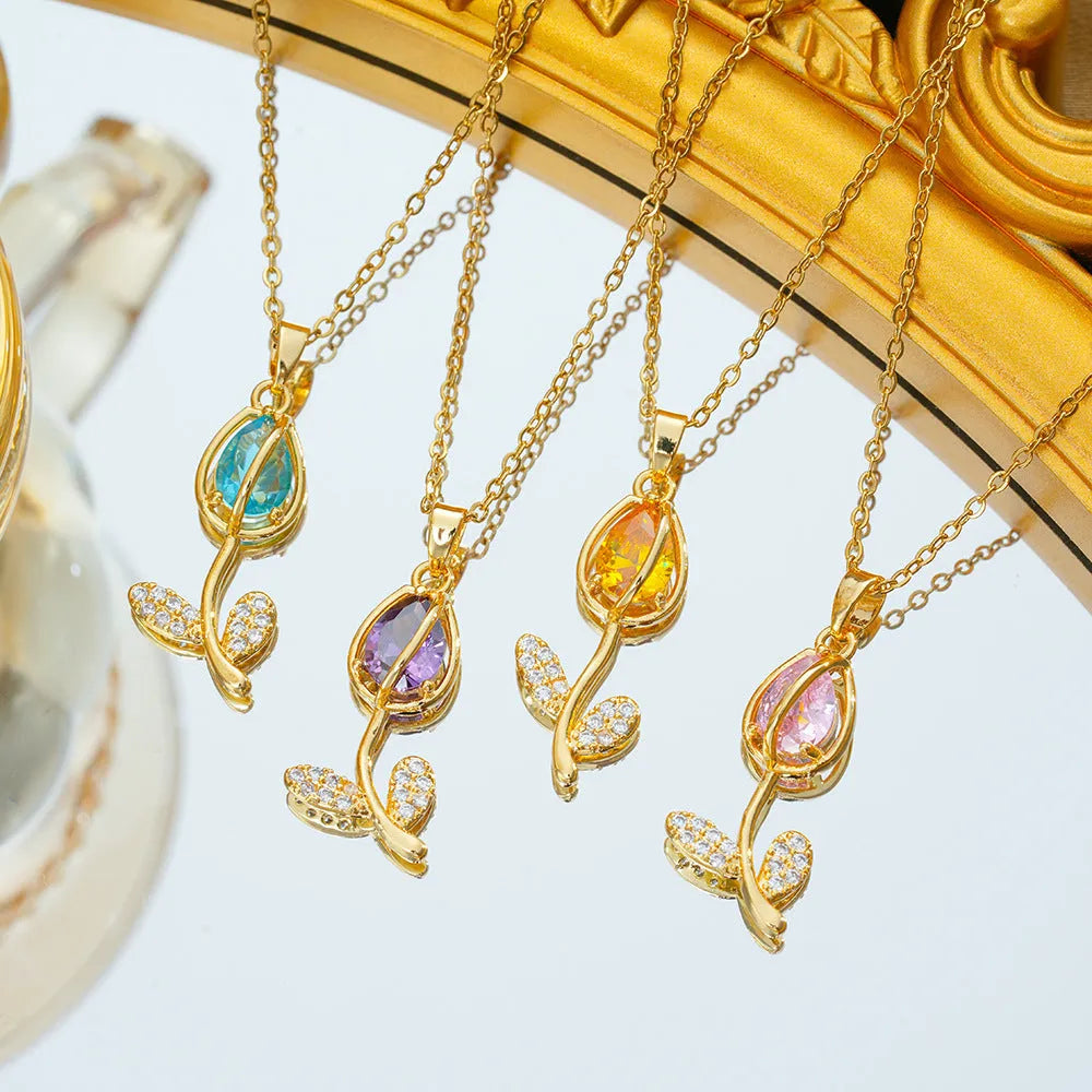 Zircon tulip flower pendant necklace for women on an O-ring chain, shown in a gold colour finish.