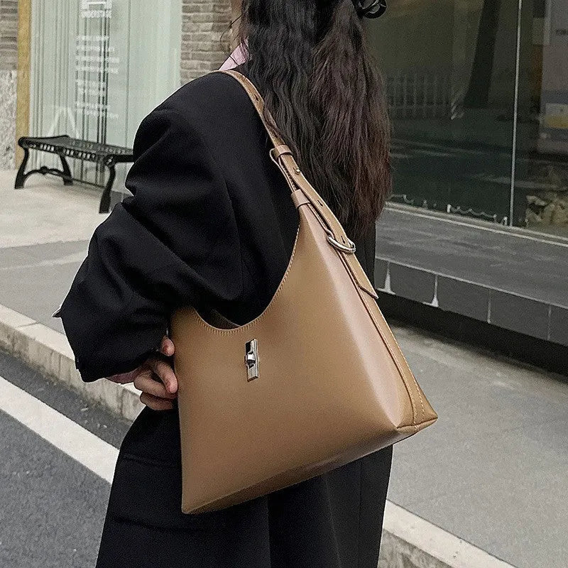 Women's apricot genuine leather crossbody bag showing dumpling shape and sandwich pocket design