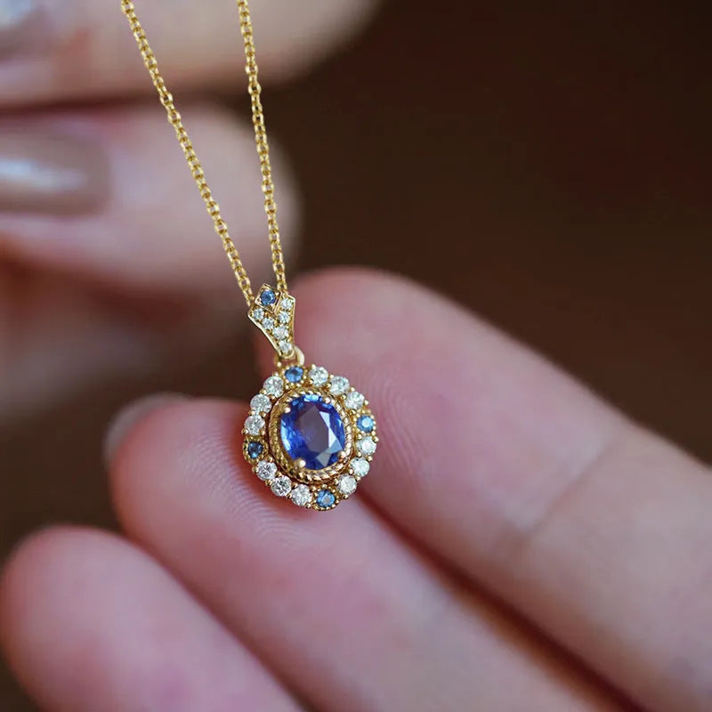 Women's adjustable royal necklace with mixed gem and zircon pendant on a copper box chain.