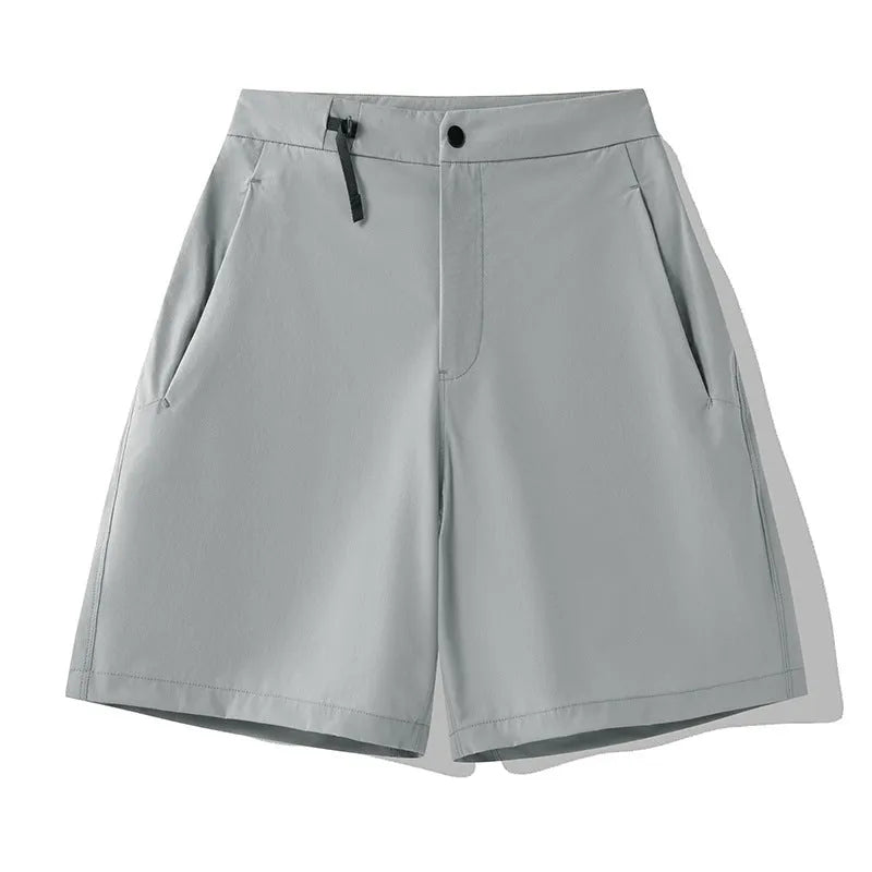 Men's quick-drying sports shorts in khaki colour with a four-sided elastic waistband, shown flat.