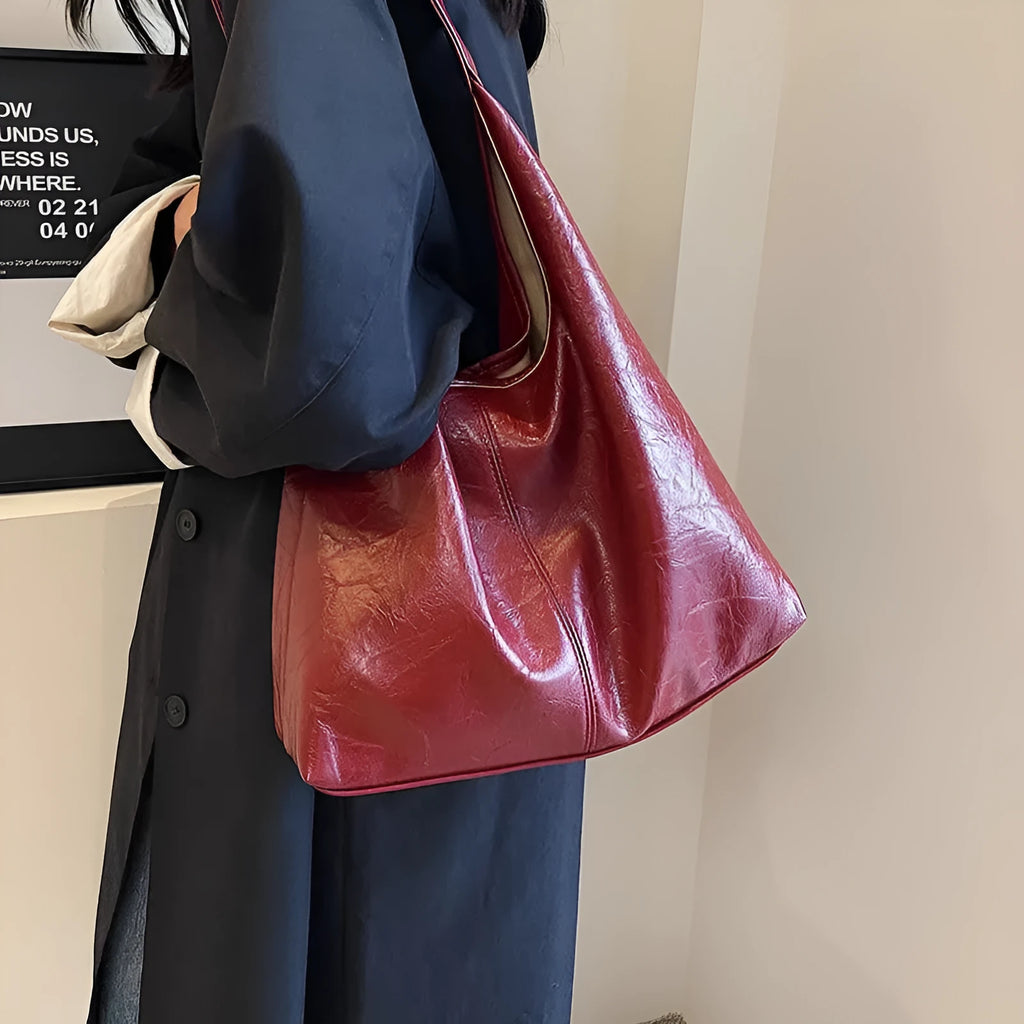 Women's casual shoulder bag in soft PU leather with sandwich pocket and visible sewing thread detail