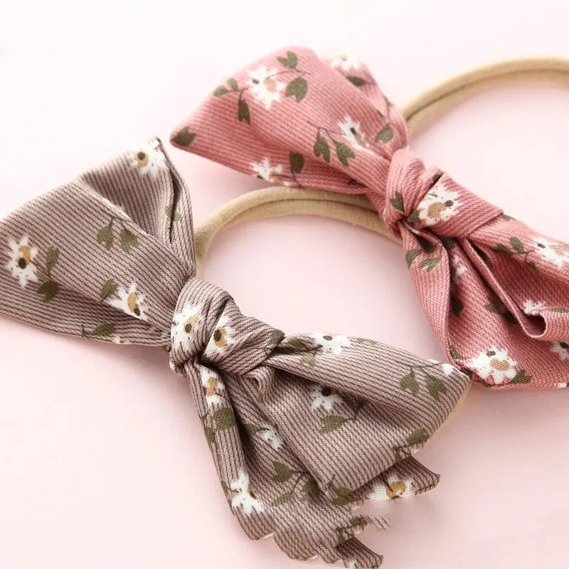 Children's knotted bow hair band in cloth fabric with six colour options