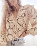 Loose black lace V-neck cardigan with a three-dimensional lace flower decoration on the chest.