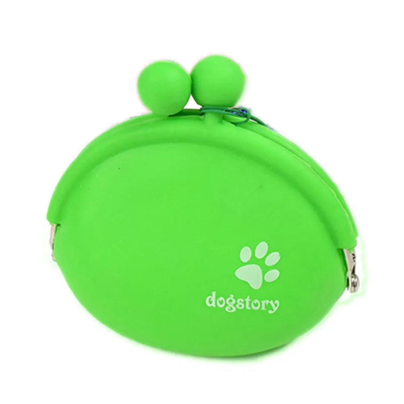 Yellow silicone dog training treat pouch with hook and loop closure, shown on a waist belt