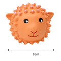 Orange and yellow spiky latex dog toy with animal design, shown next to a measuring tape showing 3 inch diameter.