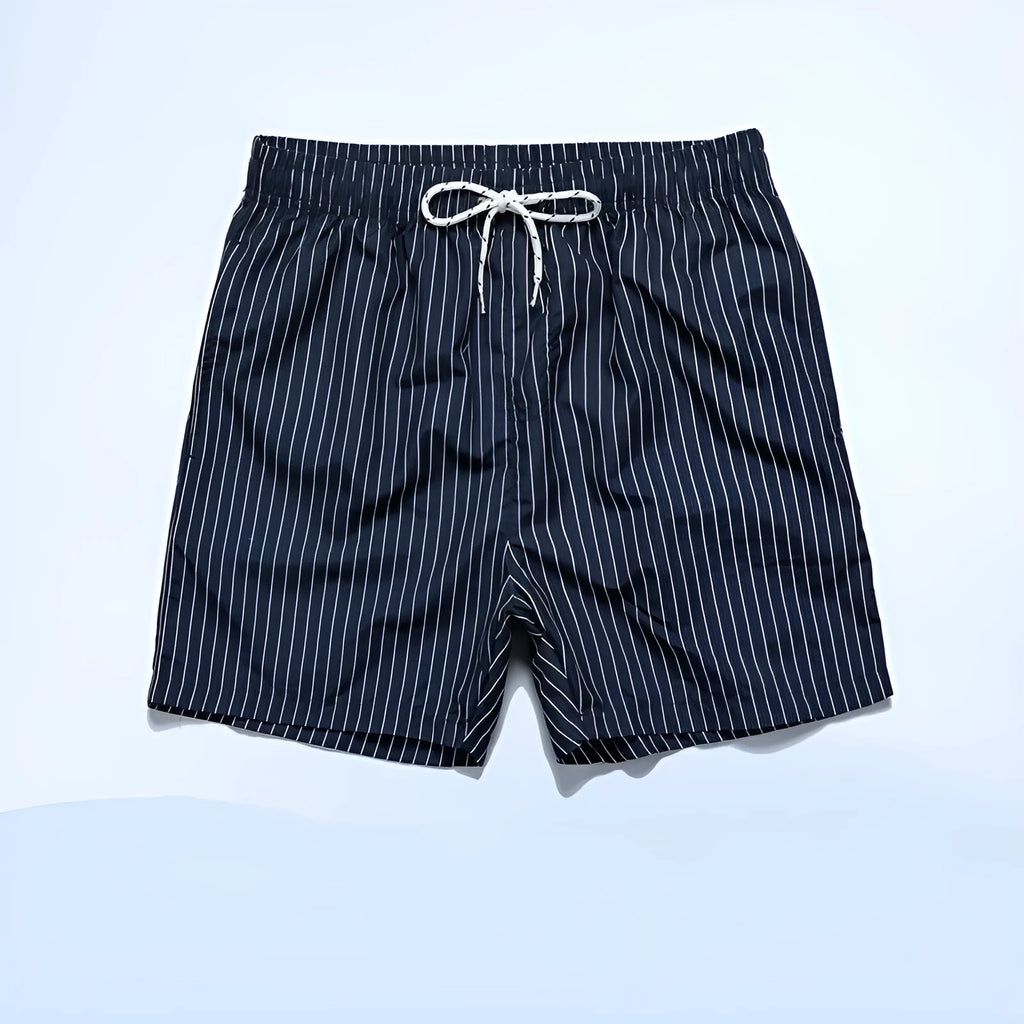 Men's navy blue and grey striped beach shorts with straight legs and built-in lining, laid flat.