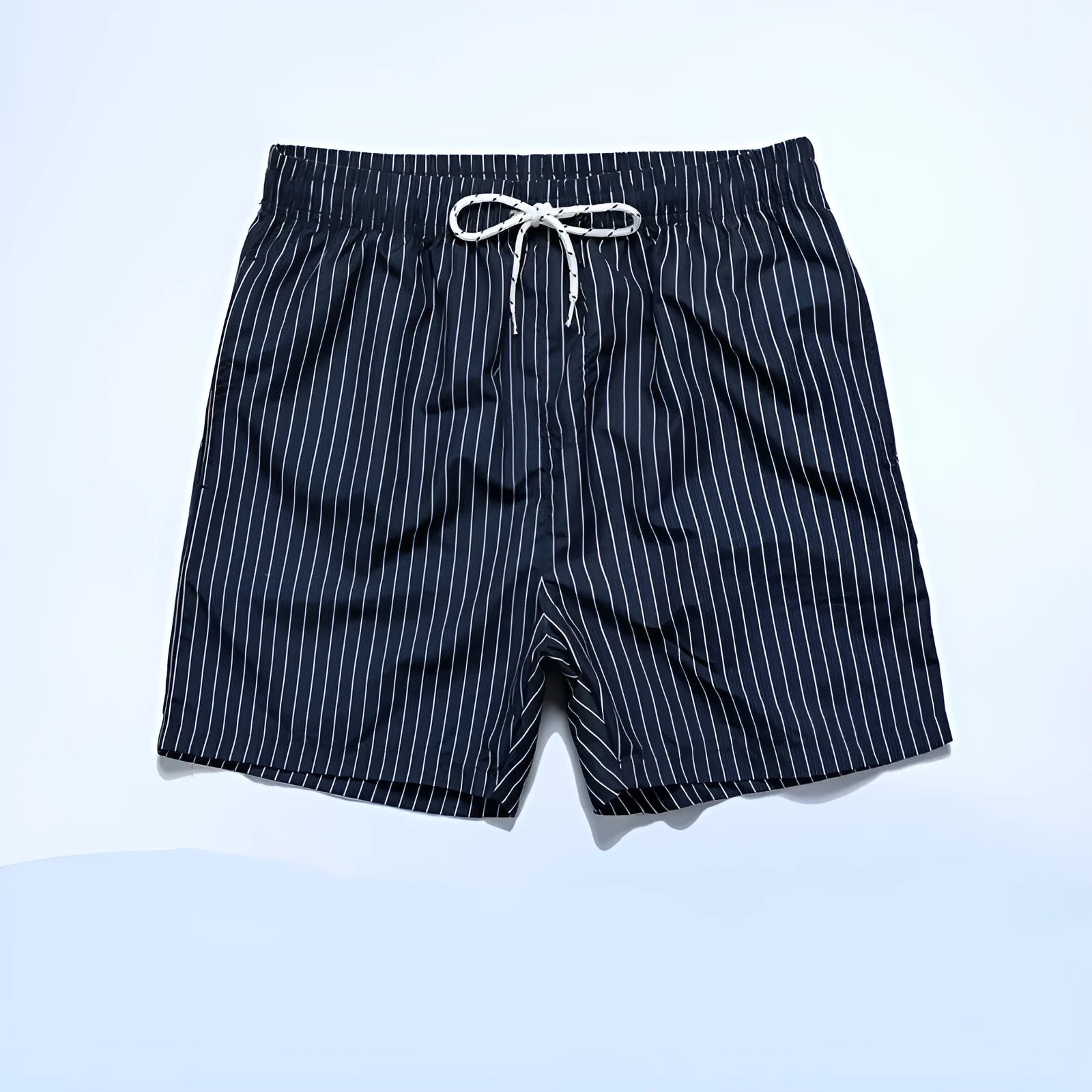 Men's navy blue and grey striped beach shorts with straight legs and built-in lining, laid flat.