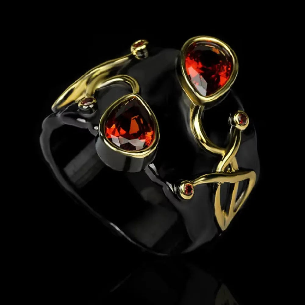 Retro women's brass oval ring in black finish on white background