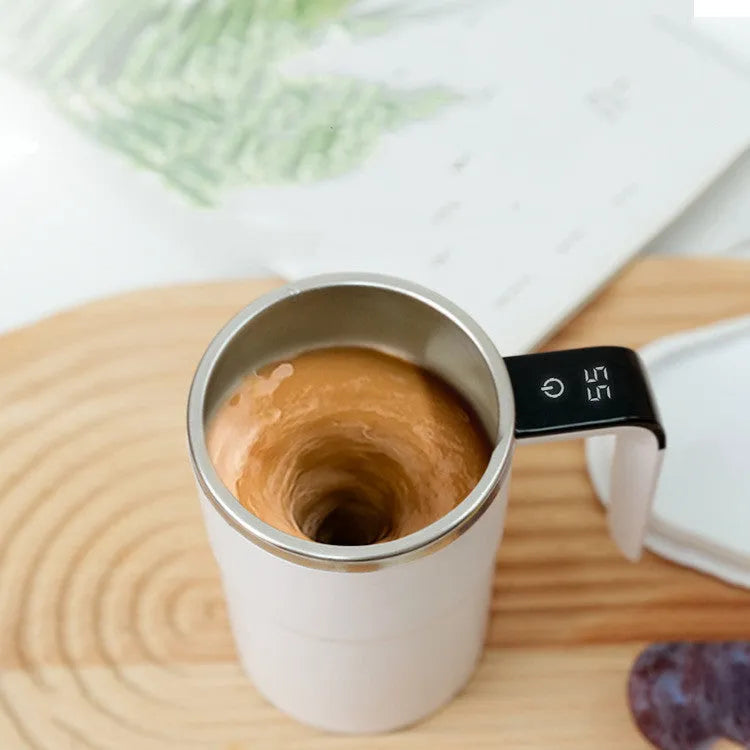 White automatic electric stirring cup with LCD screen and USB charging cable.