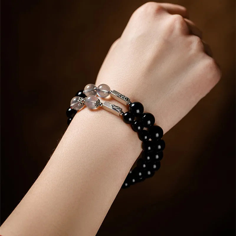 DIY kit with black obsidian Buddha beads, 8mm and 10mm sizes, and cord for a couple's bracelet set.